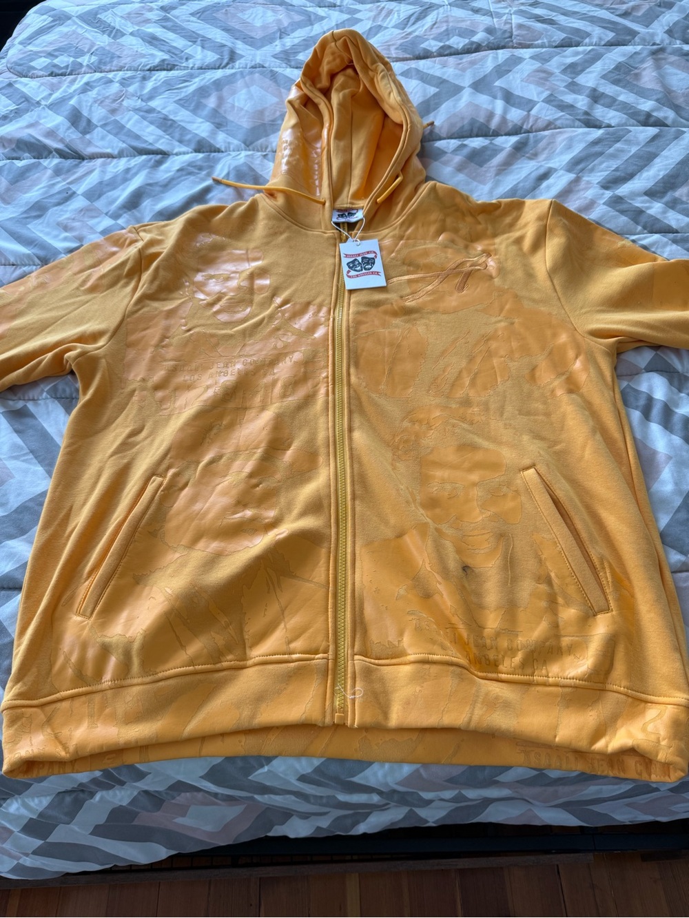 Assali Yellow-Orange Full-Zip Hoodie with Subtle Gloss Graphics